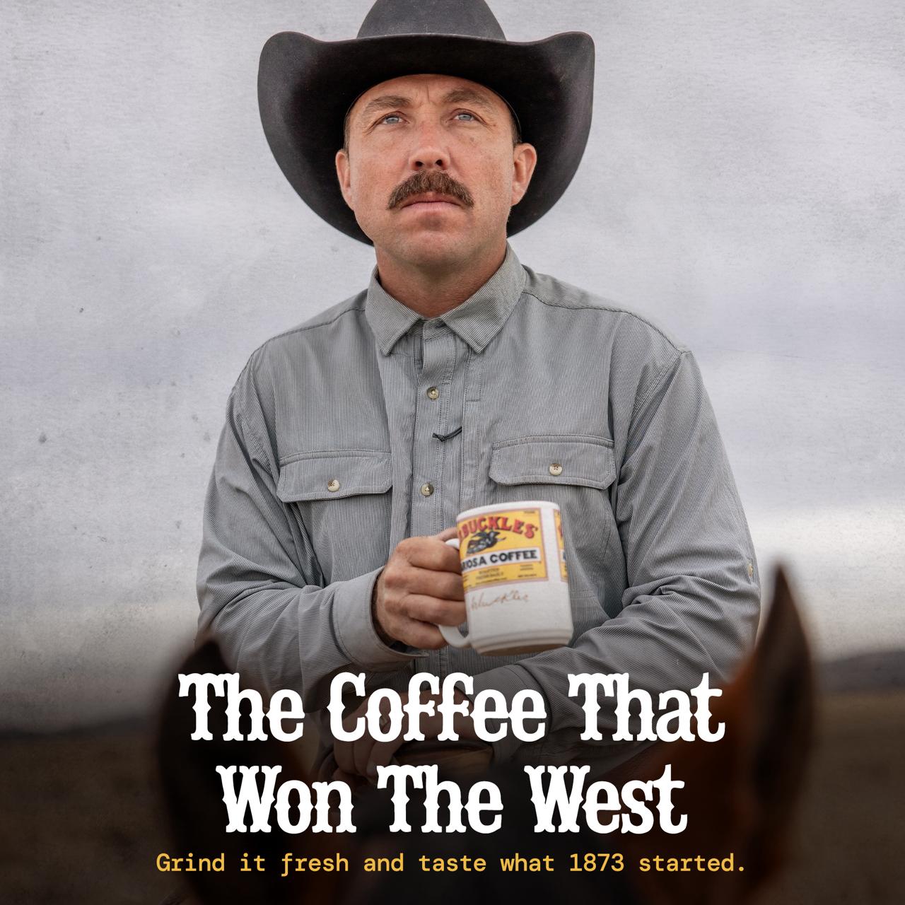 A cowboy holding an Arbuckles' Ariosa mug: the coffee that won the West. Grind it fresh and taste what 1873 started.